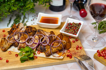 Dishes of Eastern cuisine: meat and wine.