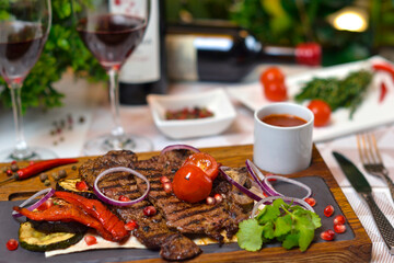 Dishes of Eastern cuisine: Steak and wine.