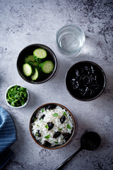 Prunes rice with parsley in a bowl
