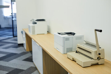 Background image of copying machines and printers set in office interior, copy space