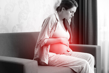 Pregnant woman at home. Different health problems during pregnancy.