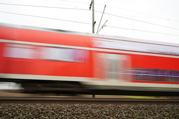 German Regional Train passing by - in-motion unsharpness - 483803605
