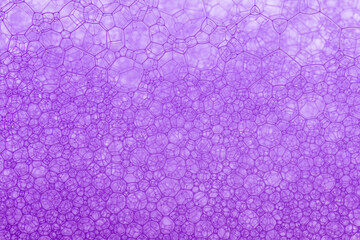 Bubbles on a red wine in the process of natural fermentation of the wort. alcoholic background