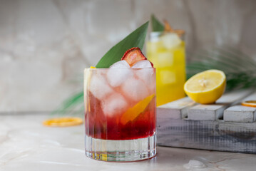classic red cocktail with tonic and ice with bamboo leaf cooling drink