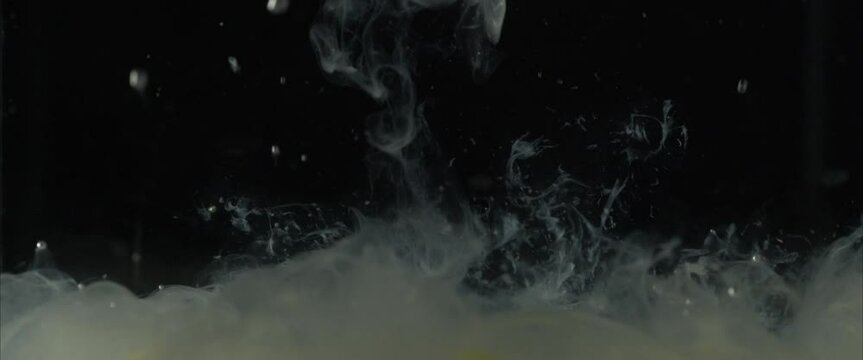 protein or egg white hitting hot water shot at 60fps, swirling water background in 6k. humorous meme content video to show male ejaculation.