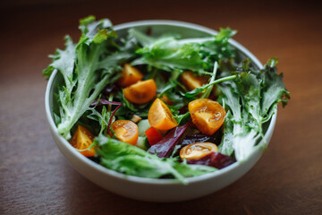 On the table a plate with vegetable salad