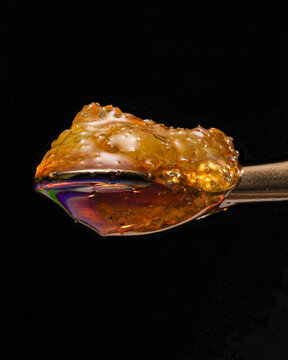 Live Resin Sauce on Titanium Dab Tool with a black background