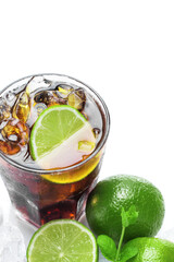 Glass of cold Cuba Libre highball cocktails or coke with ice cubes