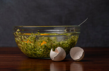 Preparing of courgette roll with ham and bacon and cheese with potatoes