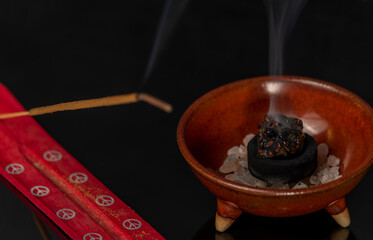 Aromatic stick and gum olibanum on black table