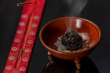 Aromatic stick and gum olibanum on black table