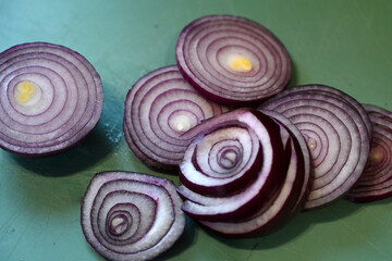 Fototapeta na wymiar Fresh sliced red onions, plant based food, cooking ingredients 