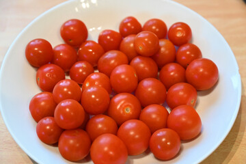 large dish of Cherry Tomatoes, local produce, plant based food, cooking ingredients 
