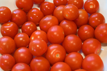 large dish of Cherry Tomatoes, local produce, plant based food, cooking ingredients 