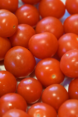 large dish of Cherry Tomatoes, local produce, plant based food, cooking ingredients 