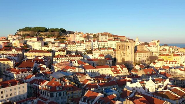 Aerial view of Cathedral of Lisbon (S&eacute; de Lisboa). Sao Jorge Castle in the background. Winter Sunset