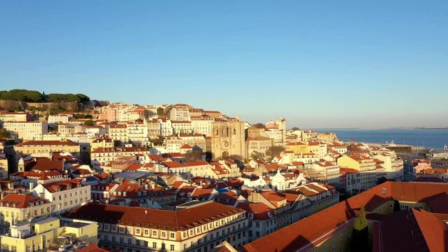 Aerial view of Cathedral of Lisbon (S&eacute; de Lisboa). Sao Jorge Castle in the background. Winter Sunset