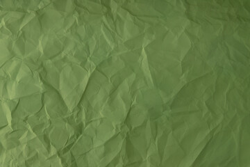 crumpled paper. sheet of green paper. detailed high resolution texture. abstract background for wallpaper.