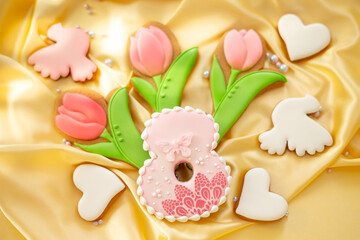 background banner greeting card for international women day with eight, tulips and pigeon shape gingerbread cookies on silk fabric background