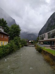 Fototapeta na wymiar river in the mountains between the houses