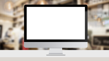 Computer Monitor mock up with white blank screen on working desk over coffee shop as background