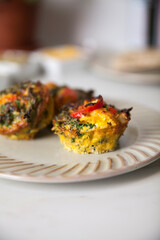Two egg frittata muffin on a plate