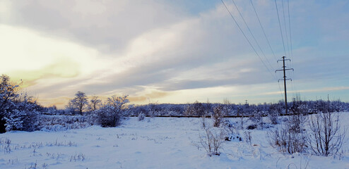 snowy rural landscape in blue tones