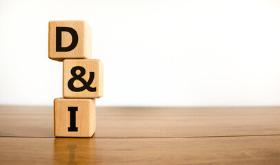D and I, Diversity and inclusion symbol. Concept words D and I, diversity and inclusion on wooden cubes on beautiful wooden table, white background. Business, D and I, diversity and inclusion concept.