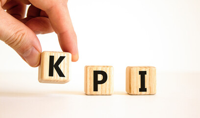 KPI, key performance indicator symbol. Concept word KPI, key performance indicator on wooden cubes on beautiful white background, copy space. Business, KPI, key performance indicator concept.