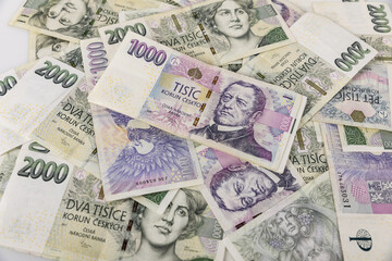 Czech banknotes scattered irregularly on the table. business, finance, investment, saving and cash concept - close up of euro paper money and coins on table