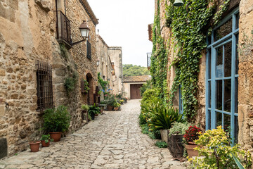 Fototapeta na wymiar Beautiful street in the medieval town of Peratallada, Gerona, Catalonia, Spain.