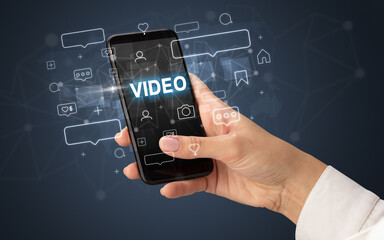 Hand using smartphone with social media concept