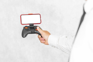 Joystick with a smartphone mockup in the hands of a guy. On a light background.