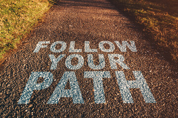 Follow your path concept, asphalt footpath in diminishing perspective