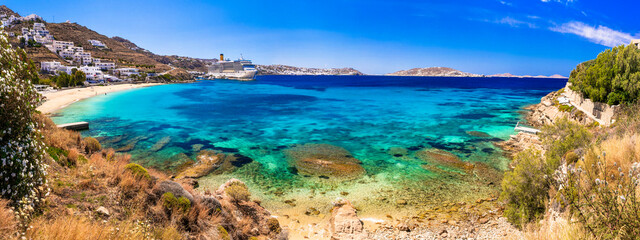 Best cruise destination in Mediterranean coast. Greece, Cyclades, Mykonos island. Cruise ship near the beach Agios Stefanos - obrazy, fototapety, plakaty
