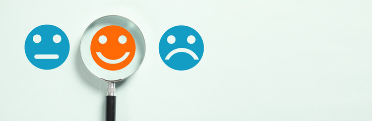 Magnifying glass with Emoticon.