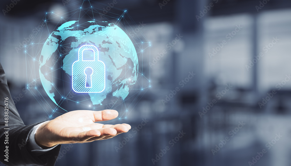 Aufkleber close up of hand holding abstract glowing globe hologram with security padlock icon on blurry office