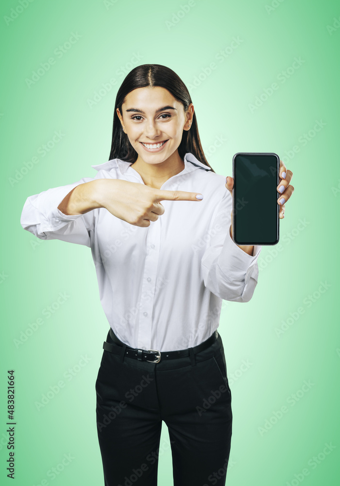 Aufkleber mobile application concept with happy girl in white shirt showing modern smartphone with mockup blan