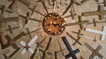 Wooden crucifixes cross on the ancient parchment paper. Handmade religion Christ crosses items made...
