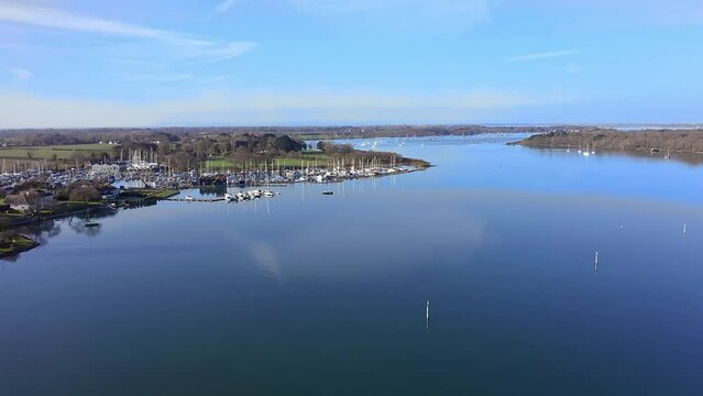 Aerial footage approaching Birdham Pool Marina situated in Chichester Harbour on the south coast of England.