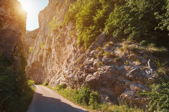 Narrow road pass between rocky cliffs
