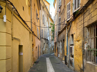 Typical colorful old city street and buildings of Aix en Provence, France