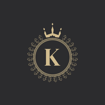 Initial Letter K Heraldic Royal Frame with Crown and Laurel Wreath. Simple Classic Emblem. Round Composition. Graphics Style. Art Elements for Logo Design Vector Illustration