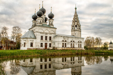 Russian church in front of lake with reflection