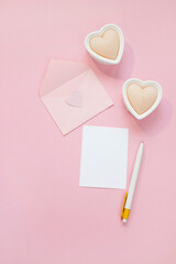 Happy Valentines Day composition. Blank greeting card mockup on pink background
