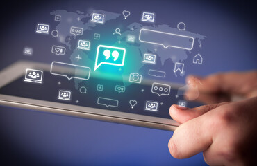 Naklejka premium Close-up of a hand using tablet, social media concept