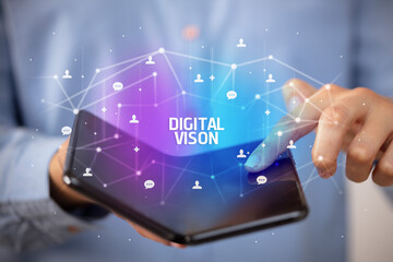 Businessman holding a foldable smartphone, new technology concept