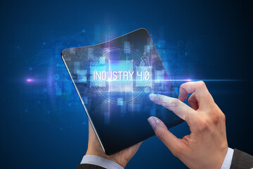 Businessman holding a foldable smartphone