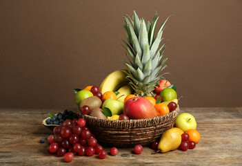 Assortment of fresh exotic fruits on wooden table