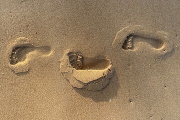 Fototapeta na wymiar footprints on sand at the beach